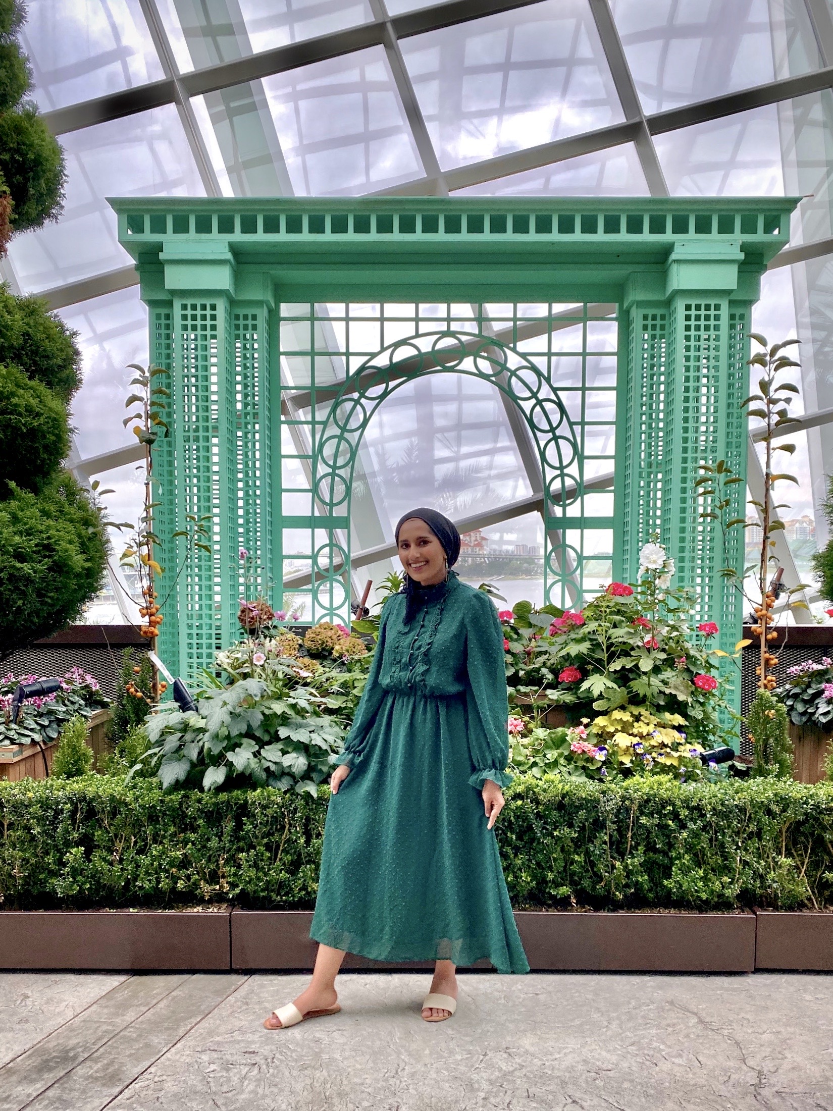 Rafa Farihah in an Emerald Green Dress at Flower Dome Singapore
