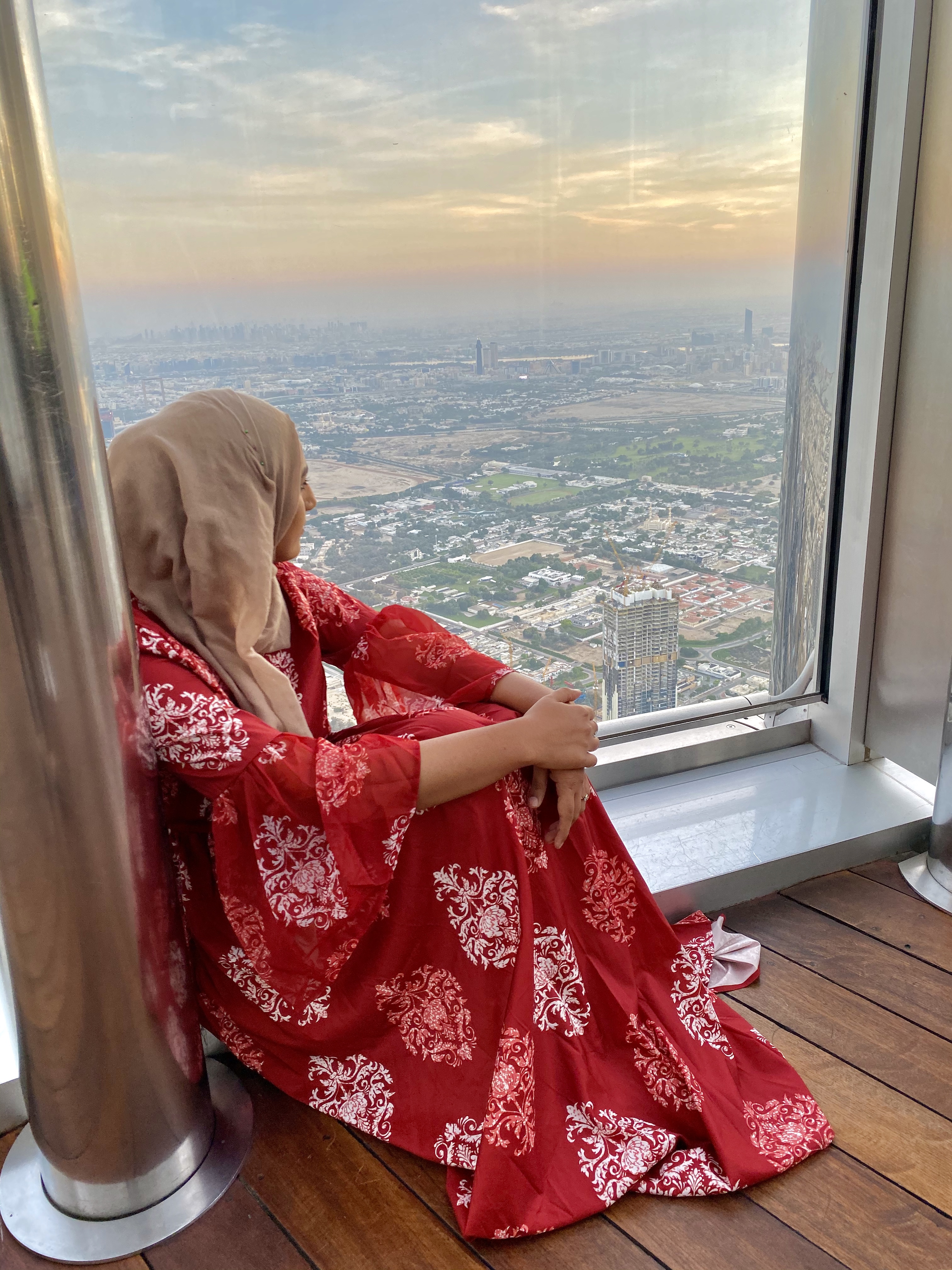 Rafa Farihah Red Maxi Dress Looking at Sunrise Burj Khalifa Dubai
